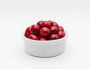 Cranberries in ramekin - isolated on white