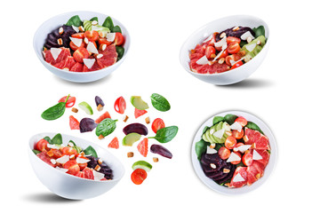 Red grapefruit beet spinach tomato salad on a white isolated background