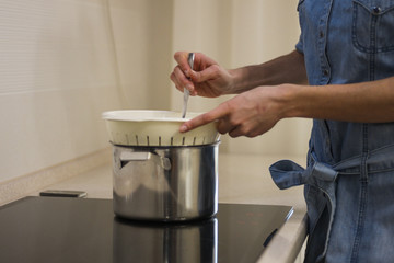 cooks in the kitchen at home