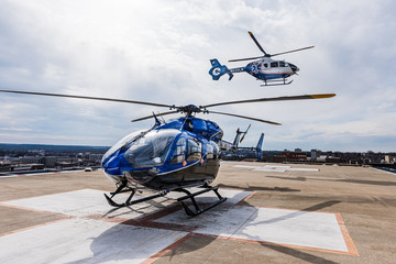 2 Medical Helicopters, One Flying Above © Bob