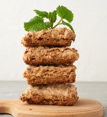 stack of baked Krakow meringue cookies on a wooden board