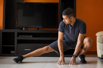 Naklejka premium Man exercising at home for coronavirus pandemic in Mexico social distancing 