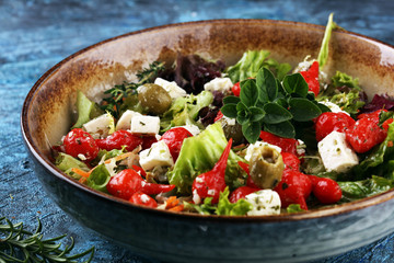Greek salad with fresh tomatoes, feta cheese and green olives. Antipasti