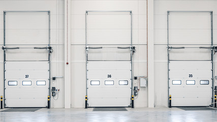 Three loading ramp doors at distribution warehouse from inside