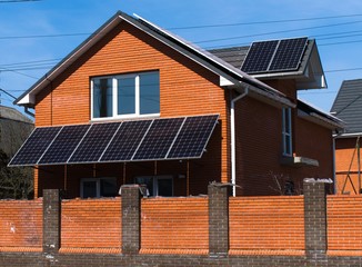 building a house with solar panels on the roof