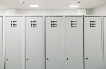 White lockers in a changing room - obrazy, fototapety, plakaty