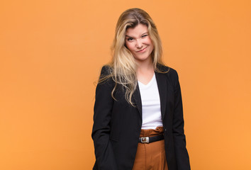  looking happy and friendly, smiling and winking an eye at you with a positive attitude