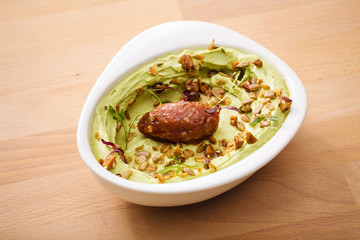 Organic plant based hummus with granola and falafel. Perfect for vegan gluten free. Freshly homemade for takeaway and delivery. Arabic food photography.