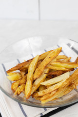 French fries served in the bowl on the table