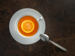 cup of tea with lemon and tea spoon on ark table