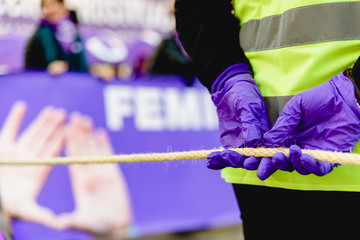 Feminist symbols of purple elements during demonstrations.