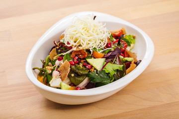 Homemade fattoush salad with vegan cheese toppings. Organic food perfect for delivery. Food photography. Arabic dish for vegetarian.