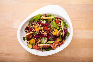 Tasty homemade vegan salad with granola grilled cheese and beet root. Organic food photography. For healthy living lifestyle. Food photography.