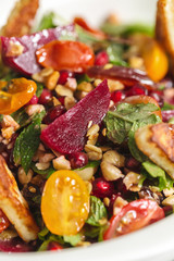 Tasty homemade vegan salad with granola grilled cheese and beet root. Organic food photography. For healthy living lifestyle. Food photography focus view.