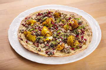 Delicious fresh homemade manakish with fried cauliflower. Perfect for vegetarian. Healthy food photography concept. Healthy living for delivery and takeaway.