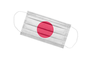 Medical face mask with flag of japan isolated on white background. pandemic concept in japan....