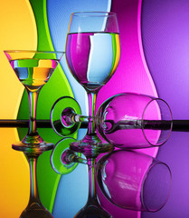 Wine glass with stunning background color patterns and reflections