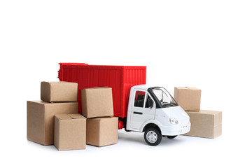 Truck model and carton boxes on white background. Courier service