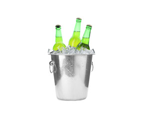 Metal bucket with bottles of beer and ice cubes isolated on white