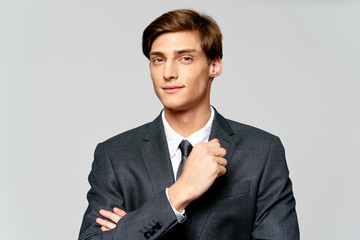 young businessman with arms crossed isolated