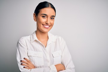 Young beautiful brunette woman wearing casual shirt over isolated white background happy face...