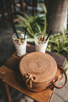 Rattan Bag And Two Coctails 