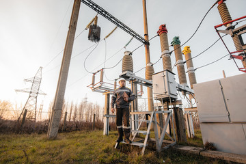 The energy engineer inspects the equipment of the substation. Power engineering. Industry
