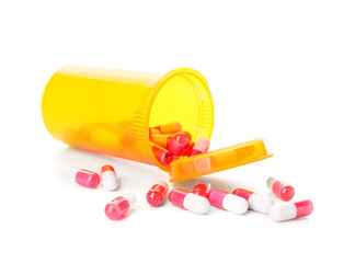 Bottle of pills on white background