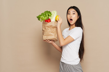 young woman holding shopping bag