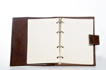 Notebookwith leather cover, notepad on white background with space for text