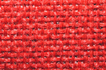 Red fabric texture. knitted textile background. woven material close up