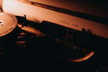 Typing "coming soon" on typewriter