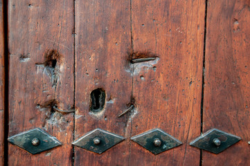 wooden door with metal inserts