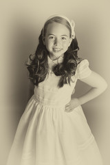 Fototapeta premium Gorgeous young girl dressed in white