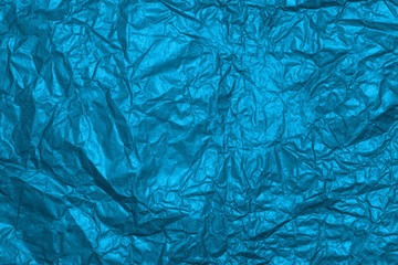 The wrinkled blue paper texture