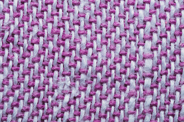 Pink fabric texture. knitted textile background. woven material macro