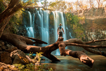 Person in amazing waterfall in the jungle of Costa Rica