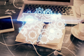 Double exposure of business theme drawings and desk with open notebook background. Concept of international market