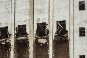 Destroyed industrial building. A ruined building. Abandoned house. Fragment 