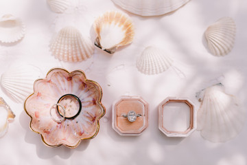 engagement ring and wedding ring lay flat