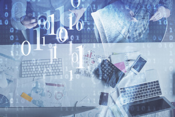 Obraz premium Double exposure of man and woman working together and data theme hologram drawing. Computer background. Top View.