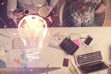 Double exposure of man and woman working together and bulb drawing. Computer background. Top View. Idea concept.