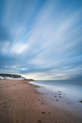sunset over the sea, white cliffs of england , long exposure, blurry clouds