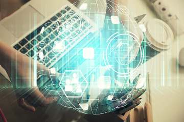 Double exposure of woman hands typing on computer and social network theme hologram drawing. People media concept.