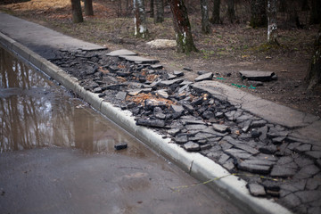 Replacing curbs on the road.