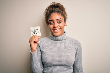 Young african american girl holding reminder paper with no word negative message with a happy face...