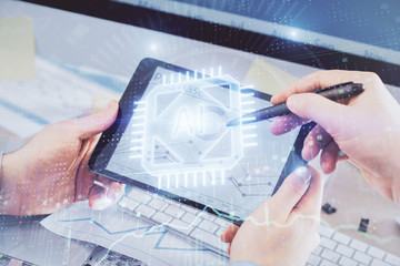 Multi exposure of man's hands holding and using a digital device and data theme drawing. Innovation concept.