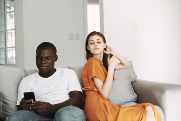 young couple sitting on sofa