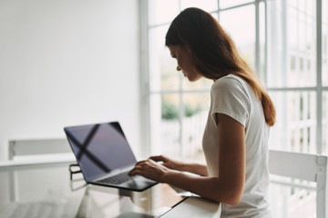 young woman using laptop