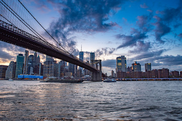 Brooklyn bridge and Manhattan skyline during sunset, blue hour, tranquil sunset in NYC